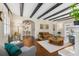 Spacious living room with hardwood floors, fireplace, and view of the dining room at 455 18Th Ne Ave, St Petersburg, FL 33704