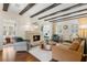 Stylish living room with exposed beams, fireplace, hardwood floors and bright windows at 455 18Th Ne Ave, St Petersburg, FL 33704