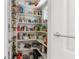 Organized pantry with shelving stocked with a variety of food items and small appliances at 455 18Th Ne Ave, St Petersburg, FL 33704