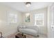 Cozy sitting room featuring a modern sofa, natural light, and neutral accents at 455 18Th Ne Ave, St Petersburg, FL 33704