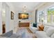 Bright and airy sitting room with large windows and comfortable seating at 455 18Th Ne Ave, St Petersburg, FL 33704