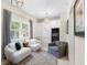Cozy sitting room with large windows, built-in cabinets, and wine cooler at 455 18Th Ne Ave, St Petersburg, FL 33704