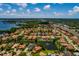 Wide aerial perspective of a residential community offering water views and landscaped yards at 4611 Grand Preserve Pl, Palm Harbor, FL 34684