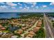 Expansive aerial view of a lakeside community with lush landscaping and serene water features at 4611 Grand Preserve Pl, Palm Harbor, FL 34684