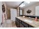 Bathroom featuring double sinks, granite countertops, and a shower-tub combo at 4611 Grand Preserve Pl, Palm Harbor, FL 34684