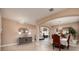 Elegant dining room with tile floors, chandelier lighting, and stylish furniture for formal gatherings at 4611 Grand Preserve Pl, Palm Harbor, FL 34684