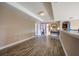 Hallway landing boasts wood floors and access to multiple rooms at 4611 Grand Preserve Pl, Palm Harbor, FL 34684