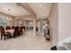 A spacious living room and dining room area with elegant decor, neutral tones, and tile flooring throughout at 4611 Grand Preserve Pl, Palm Harbor, FL 34684