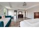 Open main bedroom boasts hardwood floors, recessed lighting, and access to additional areas of the home at 4611 Grand Preserve Pl, Palm Harbor, FL 34684