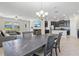 Open concept dining area seamlessly connects with the kitchen and living room at 4690 Coachford Dr, Wesley Chapel, FL 33543