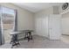 Office featuring window, carpet and black desk at 4690 Coachford Dr, Wesley Chapel, FL 33543