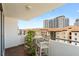 Relaxing balcony area with wood floors and seating and views of the cityscape at 470 3Rd S St # 602, St Petersburg, FL 33701