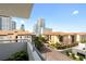 Stunning balcony view of downtown buildings and city street from a condo with palm trees and blue skies at 470 3Rd S St # 602, St Petersburg, FL 33701