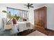 Bright bedroom with dark hardwood floors, a ceiling fan, and an amazing view at 470 3Rd S St # 602, St Petersburg, FL 33701