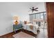Cozy bedroom featuring dark hardwood floors, a ceiling fan, and lots of natural light at 470 3Rd S St # 602, St Petersburg, FL 33701