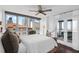 Light-filled bedroom with dark wood floors, large windows, and private balcony access at 470 3Rd S St # 602, St Petersburg, FL 33701