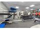 Spacious gym with weightlifting equipment, large mirror, and large windows overlooking the pool at 470 3Rd S St # 602, St Petersburg, FL 33701