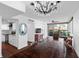 Open-concept living area with modern lighting, hardwood floors, and a balcony overlooking the city at 470 3Rd S St # 602, St Petersburg, FL 33701