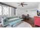 Cozy living room with a ceiling fan, a dining area, and large windows that let in ample natural light at 470 3Rd S St # 602, St Petersburg, FL 33701