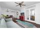 Comfortable living space featuring a ceiling fan, a dining area, and glass doors to another room at 470 3Rd S St # 602, St Petersburg, FL 33701