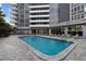 Beautiful outdoor pool surrounded by lounge chairs and patio, perfect for relaxing and enjoying the sun at 470 3Rd S St # 602, St Petersburg, FL 33701