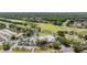 Overhead view of the golf course and clubhouse offers a beautiful landscape complete with convenient parking spaces at 4915 Augusta Ave, Oldsmar, FL 34677