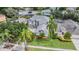 Aerial view of home with lush landscaping, fenced yard, and community pool at 4915 Augusta Ave, Oldsmar, FL 34677