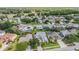 Aerial view of home located in a residential neighborhood with mature trees and lush landscaping at 4915 Augusta Ave, Oldsmar, FL 34677