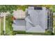 An aerial view of a well-maintained home featuring a pool, lanai, and a driveway at 4915 Augusta Ave, Oldsmar, FL 34677