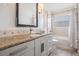 Bathroom vanity with a granite countertop and stylish cabinetry at 4915 Augusta Ave, Oldsmar, FL 34677