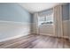 Comfortable bedroom with neutral paint and light-colored flooring at 4915 Augusta Ave, Oldsmar, FL 34677
