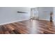 Bright bedroom with hardwood floors, a large window, and modern decor at 4915 Augusta Ave, Oldsmar, FL 34677
