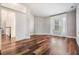 Inviting bedroom with a view, hardwood floors, and warm neutral walls at 4915 Augusta Ave, Oldsmar, FL 34677