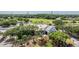 A scenic view of the clubhouse amidst lush greenery, trees, and landscaping at 4915 Augusta Ave, Oldsmar, FL 34677