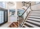 Stately foyer with wood floors, chandelier, and staircase at 4915 Augusta Ave, Oldsmar, FL 34677
