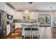 Bright kitchen features an island, stainless steel appliances, and a seamless connection to the outdoor pool area at 4915 Augusta Ave, Oldsmar, FL 34677