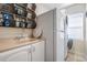 Laundry Room featuring modern appliances, ample counter space, and overhead storage at 4915 Augusta Ave, Oldsmar, FL 34677