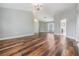 Large, open living room area with wood-look floors, neutral walls, and great natural light at 4915 Augusta Ave, Oldsmar, FL 34677