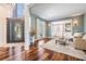 Bright and airy living room with hardwood floors, neutral décor, and an open floor plan at 4915 Augusta Ave, Oldsmar, FL 34677