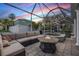 Relaxing lanai with fire pit, outdoor seating and sparkling swimming pool and spa at 4915 Augusta Ave, Oldsmar, FL 34677