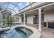 Luxurious pool and spa area with covered patio, perfect for outdoor entertaining at 4915 Augusta Ave, Oldsmar, FL 34677