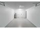 Bright basement with painted concrete walls and epoxy flooring at 5341 Tangerine Dr, Zephyrhills, FL 33542