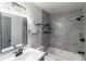Updated bathroom featuring modern fixtures, stylish tile, and contemporary shelving for storage at 5341 Tangerine Dr, Zephyrhills, FL 33542
