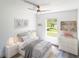 Cozy and bright bedroom with a ceiling fan, large window, and neutral colors at 5341 Tangerine Dr, Zephyrhills, FL 33542