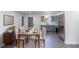 Open-concept dining room flowing into a modern kitchen with stainless steel appliances at 5341 Tangerine Dr, Zephyrhills, FL 33542