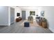 A contemporary living room design with gray flooring, sophisticated furniture, and stylish decor at 5341 Tangerine Dr, Zephyrhills, FL 33542