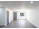 Bright, open living space with modern gray flooring, neutral walls, and recessed lighting at 5341 Tangerine Dr, Zephyrhills, FL 33542
