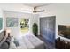 Main bedroom features a ceiling fan, a window, and a large closet with sliding doors at 5341 Tangerine Dr, Zephyrhills, FL 33542