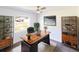 Bright home office with a large desk, and neutral colors perfect for working at home at 5341 Tangerine Dr, Zephyrhills, FL 33542
