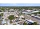 This aerial view showcases the property's neighborhood with mature trees and nearby retail at 5405 59Th N St, St Petersburg, FL 33709